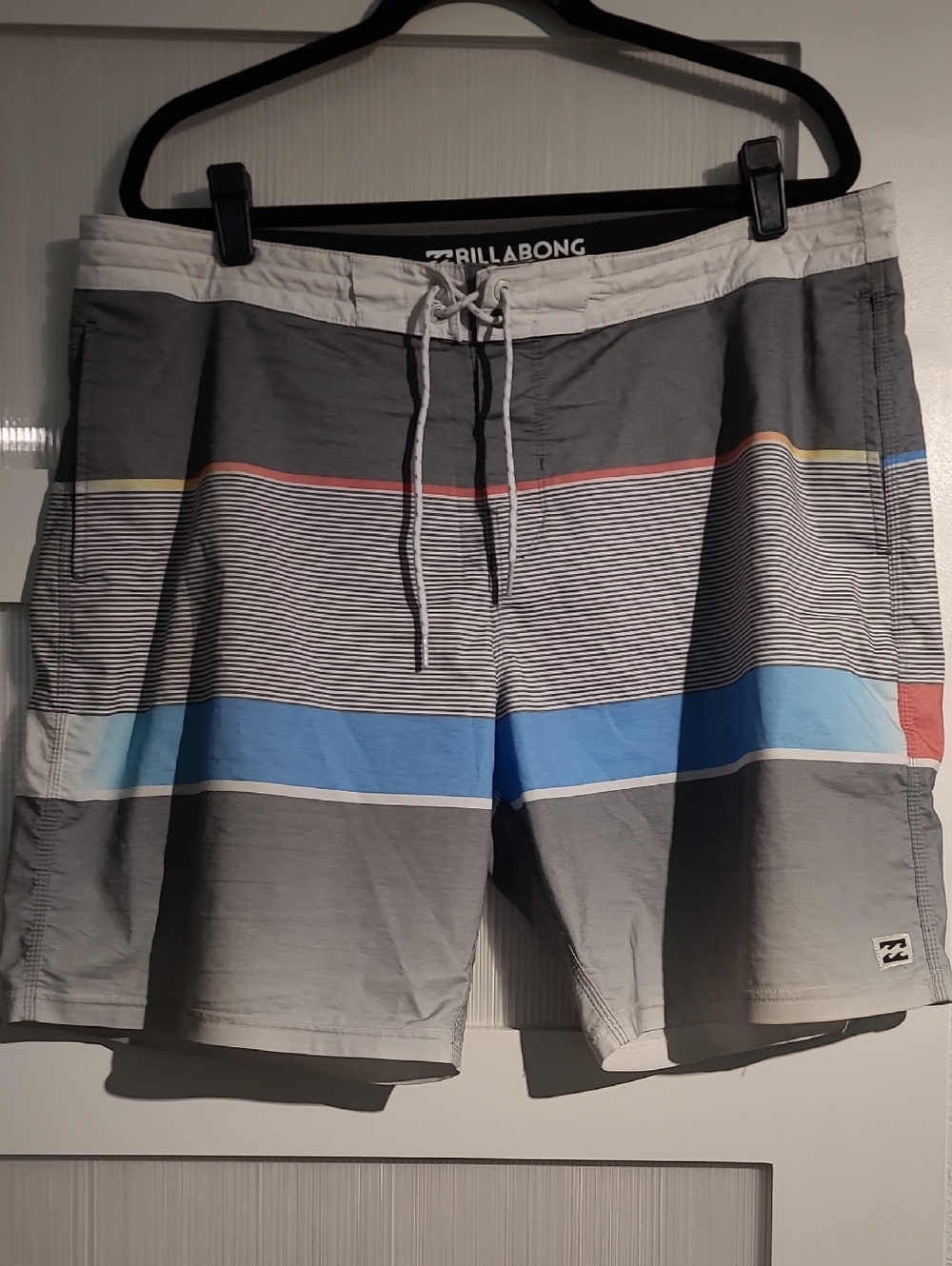 Billabong Men’s Gray Board Shorts with Blue and Red Stripe Accents